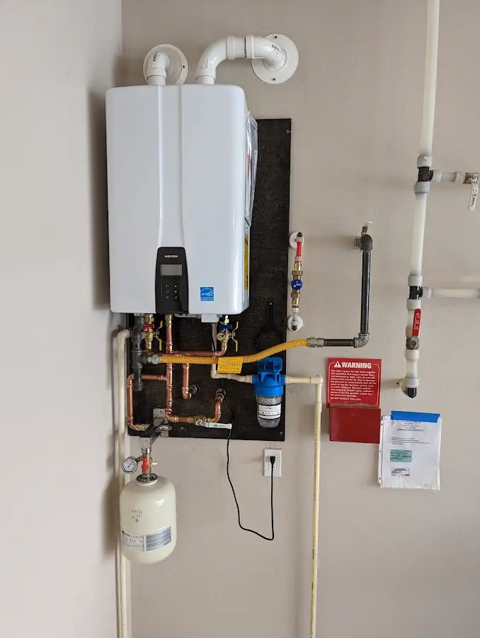 Professional plumber installing copper piping in a Middleburgh home